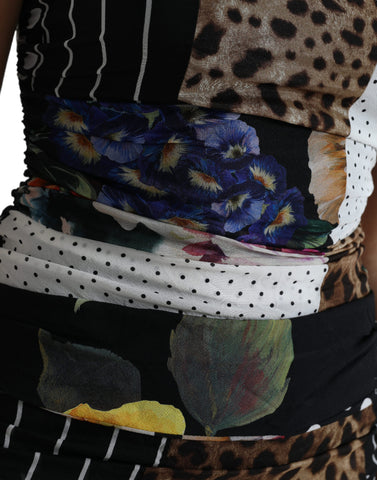 Multicolor patchwork floral and leopard print midi bodycon dress by Dolce & Gabbana, showcasing vibrant fabric and fitted silhouette.