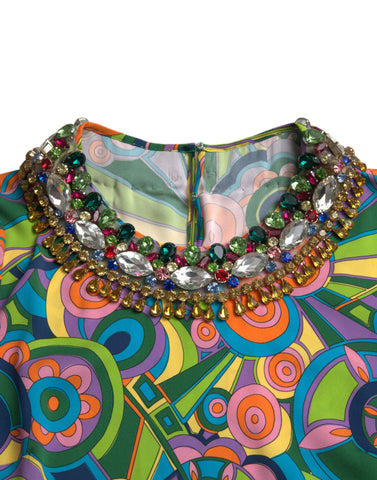 Multicolor geometric print silk midi dress by Dolce & Gabbana featuring a fitted silhouette and crystal embellishments.