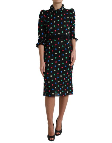 Black polka dot ruffle cotton midi dress by Dolce & Gabbana, featuring a flowing silhouette and playful ruffle details.