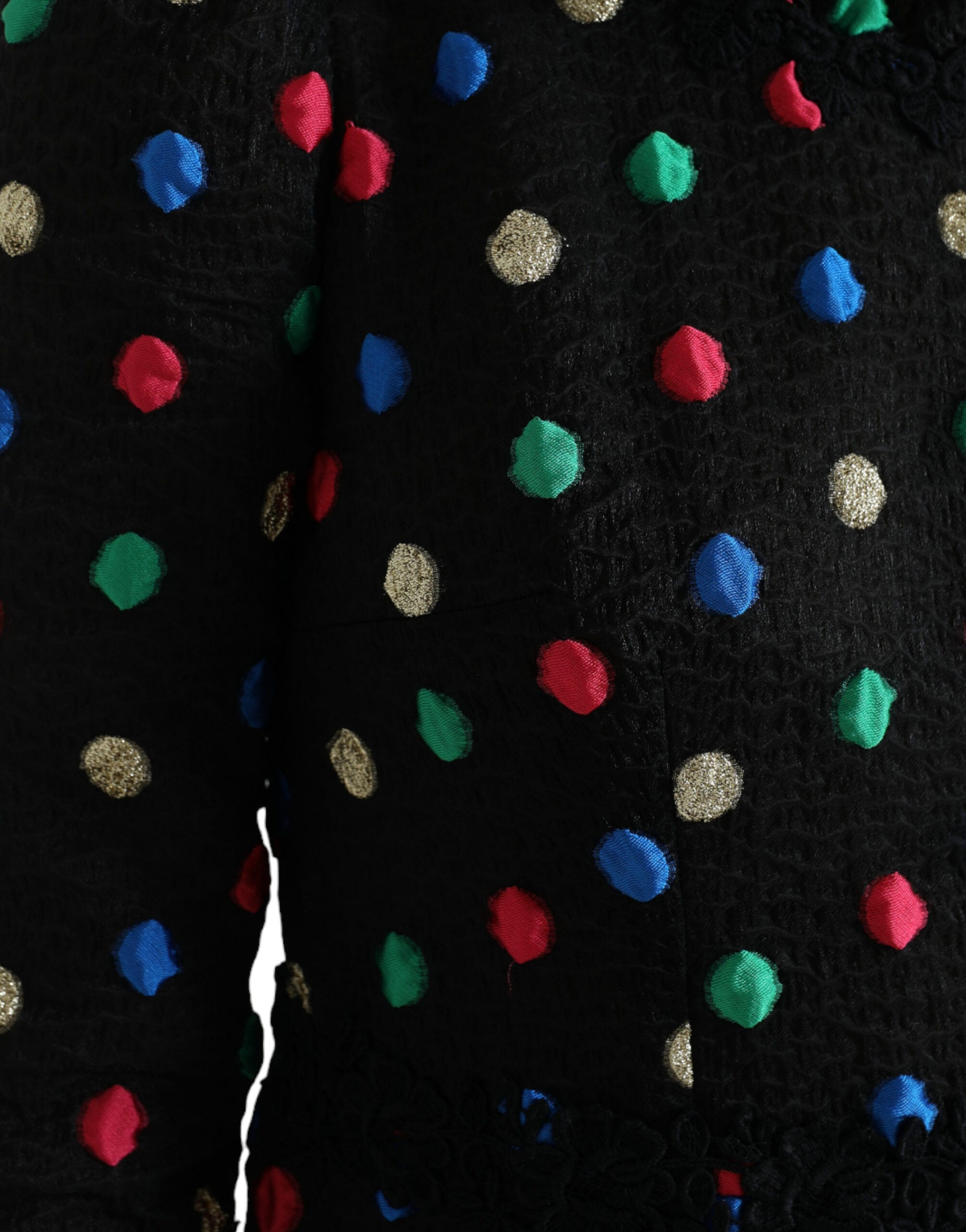 Black polka dot ruffle cotton midi dress by Dolce & Gabbana, featuring a flared skirt and playful ruffle details.