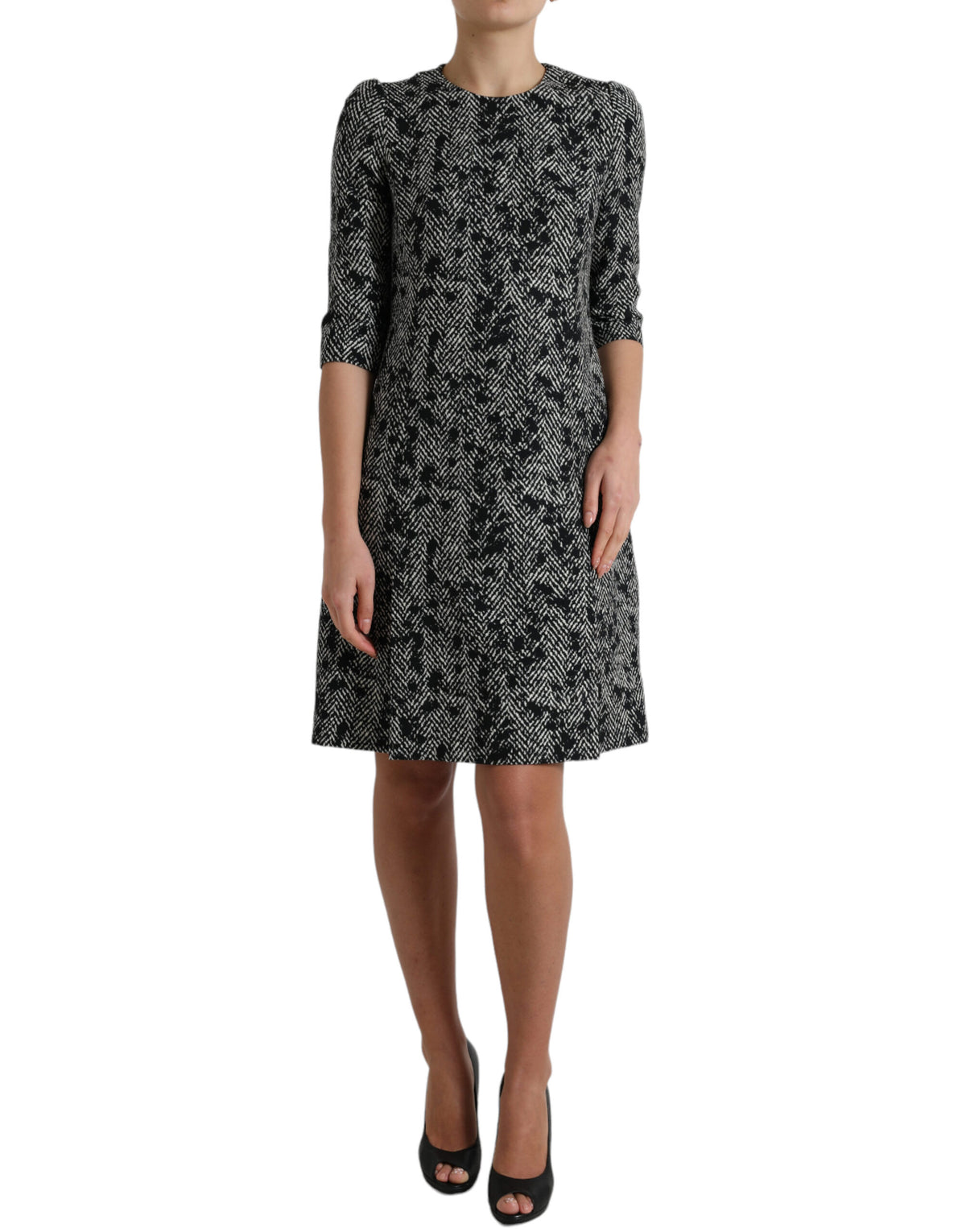 Black polyester shift mini dress with chevron pattern by Dolce & Gabbana, showcasing a sleek and stylish silhouette.