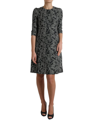 Black polyester shift mini dress with chevron pattern by Dolce & Gabbana, showcasing a sleek and stylish silhouette.