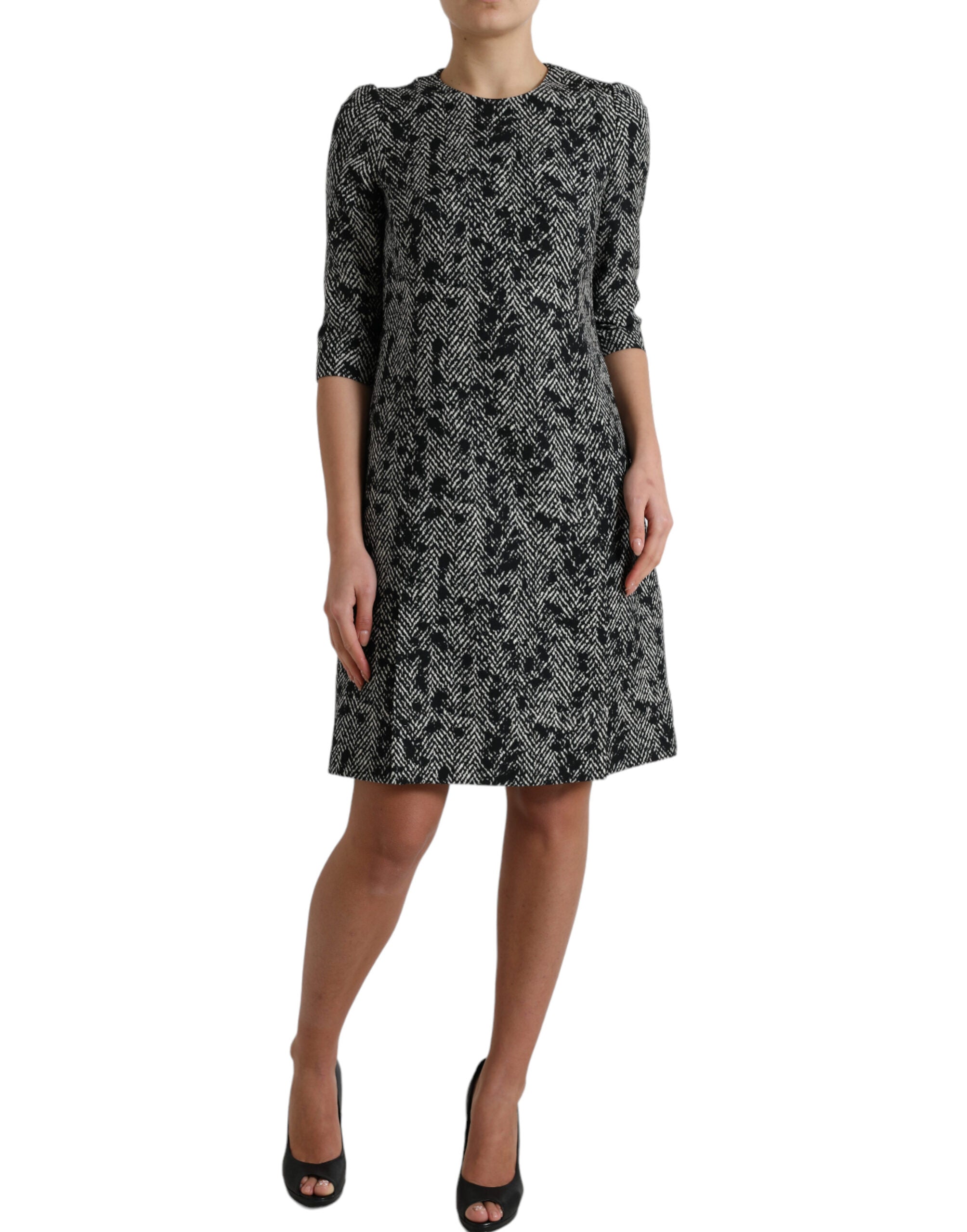 Black polyester mini dress with chevron pattern from Dolce & Gabbana, featuring a sleek shift silhouette and stylish design.