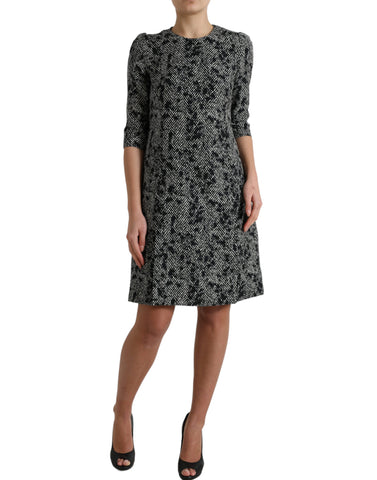 Black polyester mini dress with chevron pattern from Dolce & Gabbana, featuring a sleek shift silhouette and stylish design.