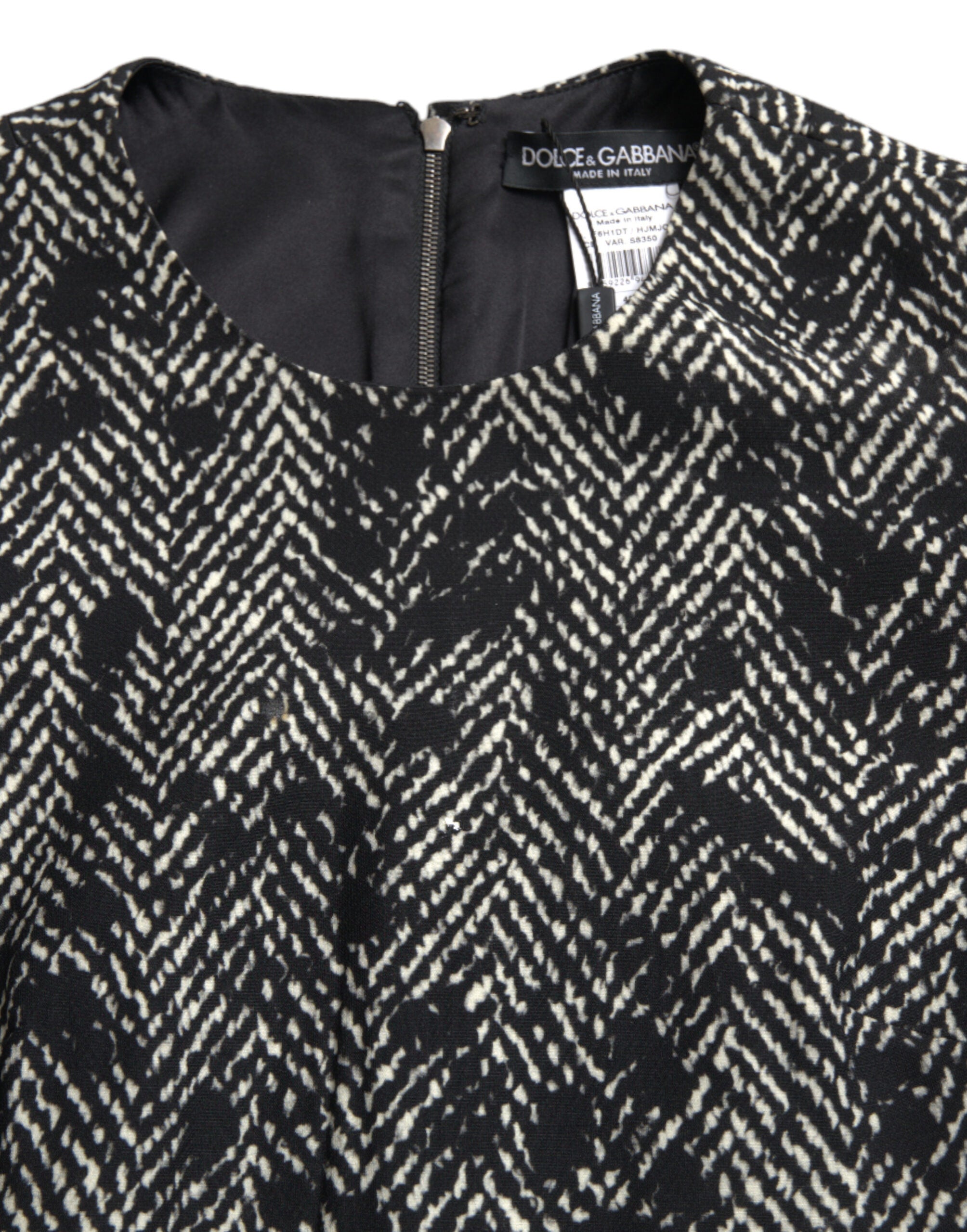 Black Chevron polyester shift mini dress by Dolce & Gabbana, featuring a stylish V-neck and sleeveless design.