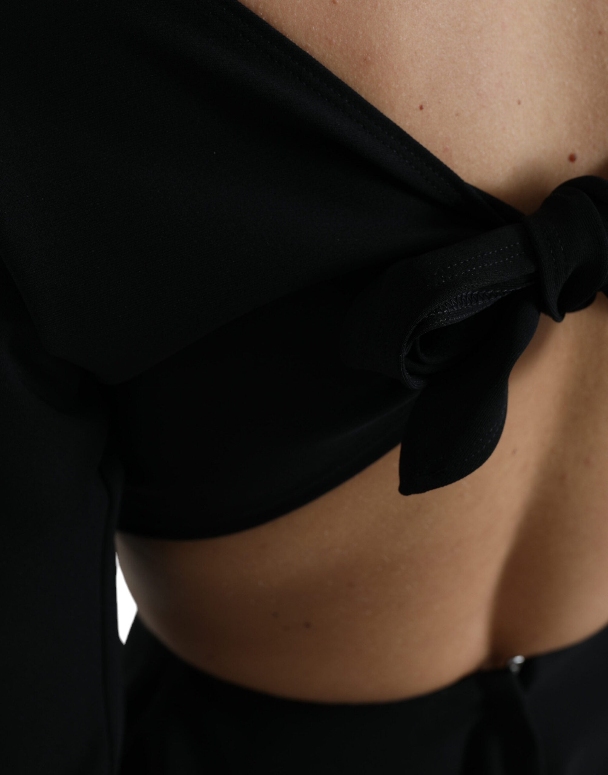 Black viscose cut-out A-line long sleeve mini dress by Dolce & Gabbana, shown on a model with stylish detailing.