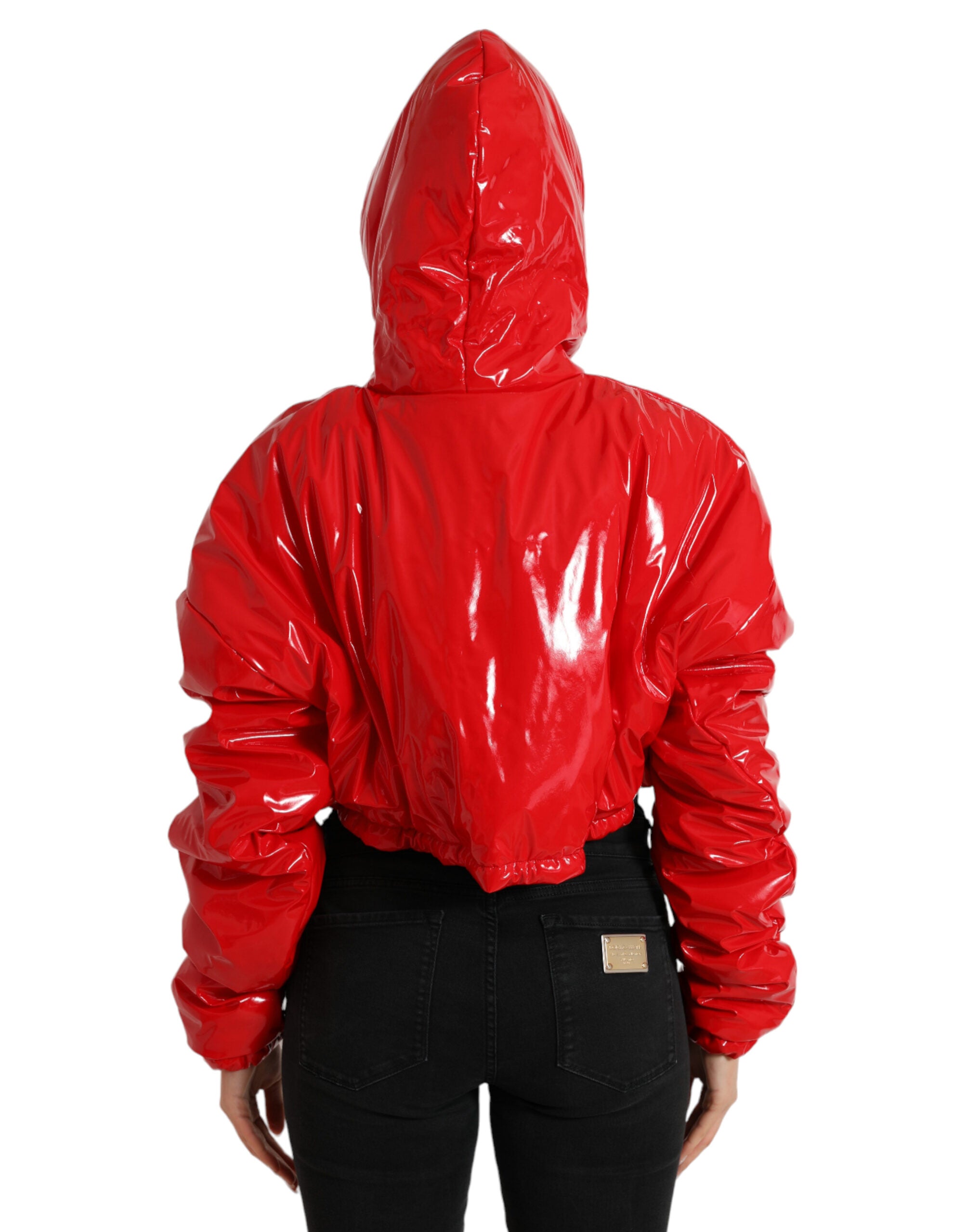 Shiny red hooded cropped short coat jacket by Dolce & Gabbana, featuring a sleek, glossy finish and stylish hood detail.