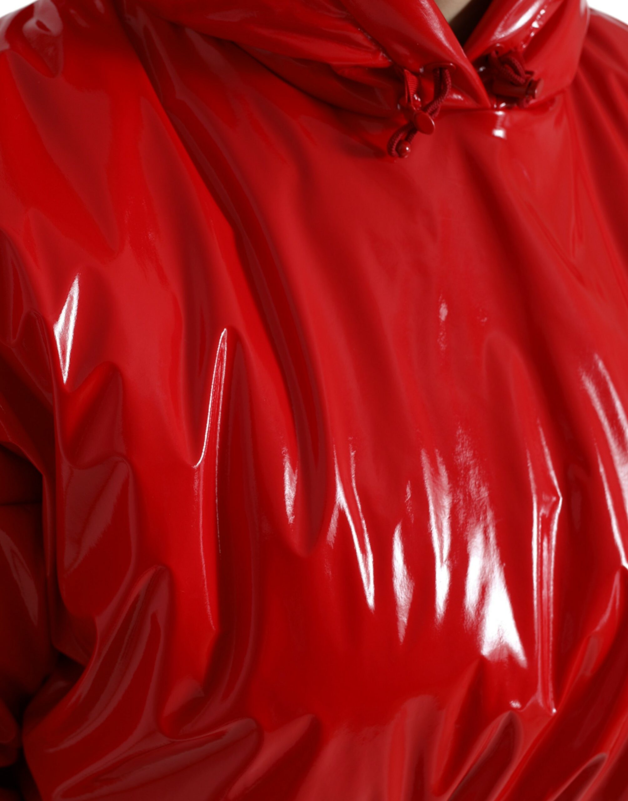 Shiny red hooded cropped short coat jacket by Dolce & Gabbana, featuring a sleek design and stylish hood detail.