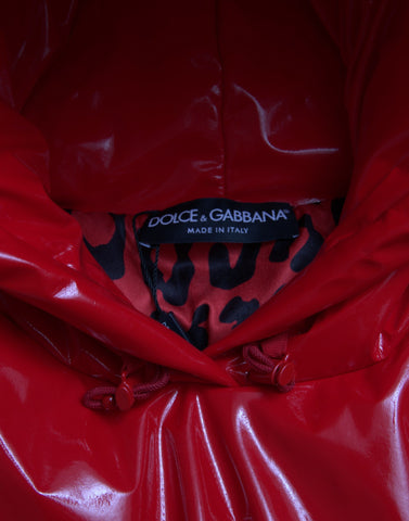 Shiny red hooded cropped short coat jacket by Dolce & Gabbana, featuring a sleek, glossy finish and stylish hood design.