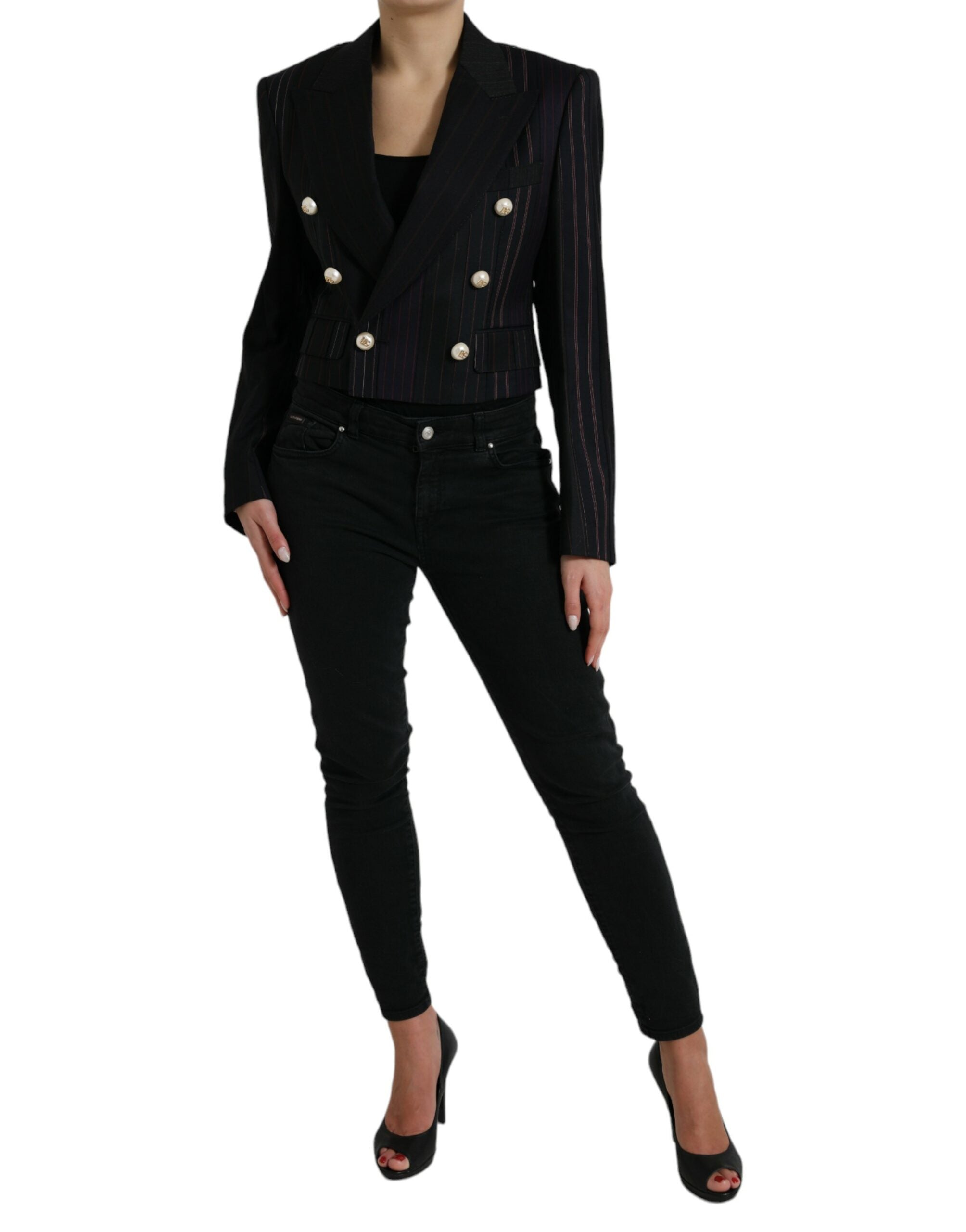 Black striped Sicilia double-breasted jacket by Dolce & Gabbana, tailored with lapels and button details, displayed on a hanger.