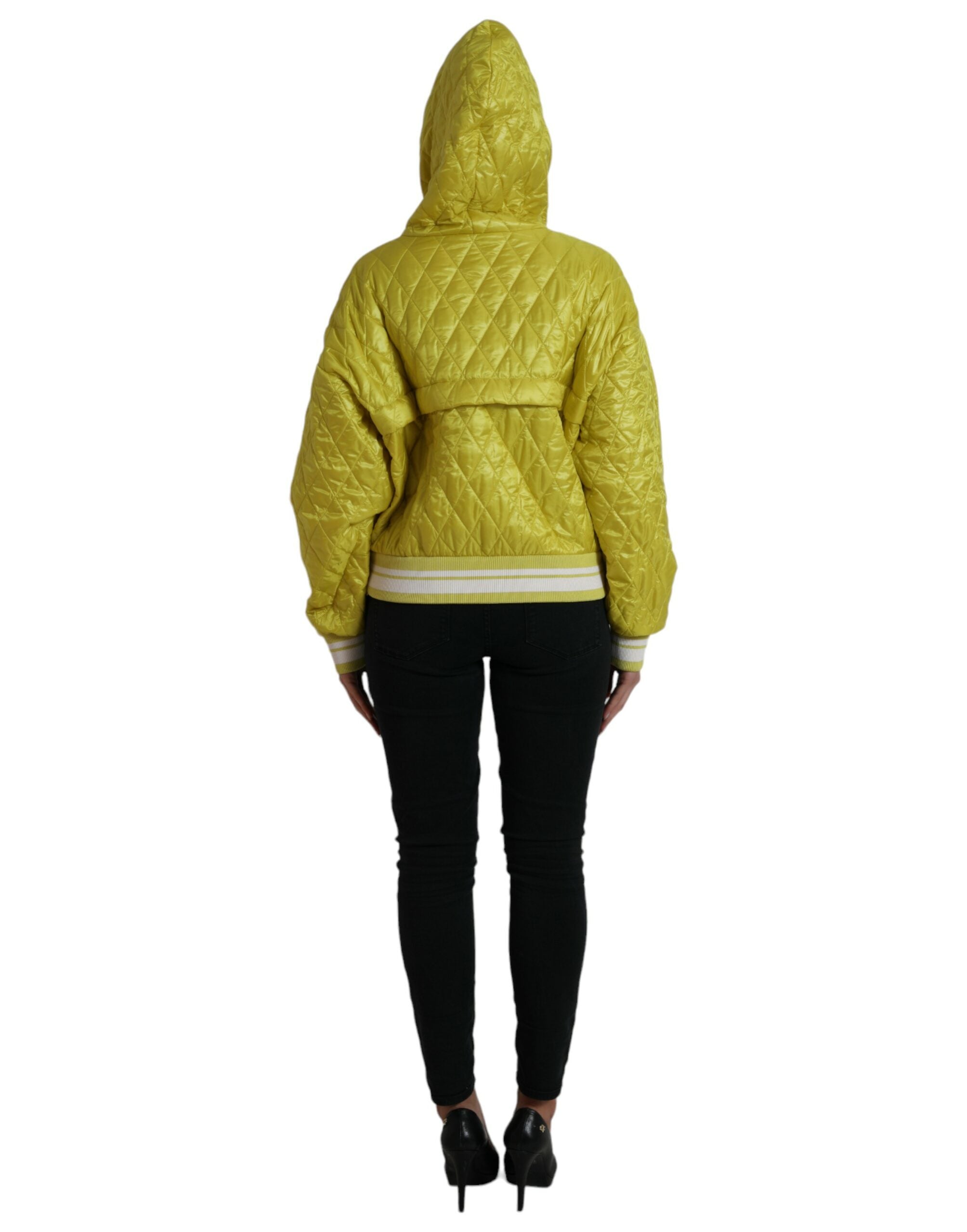 Yellow nylon quilted hooded pullover jacket by Dolce & Gabbana, featuring a stylish quilted design and hooded collar.