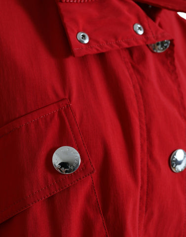 Red polyester hooded rain coat with button closure by Dolce & Gabbana, featuring a stylish waterproof jacket for rainy days.