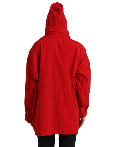 Red polyester hooded rain coat jacket by Dolce & Gabbana with button closure, shown in a close-up view.