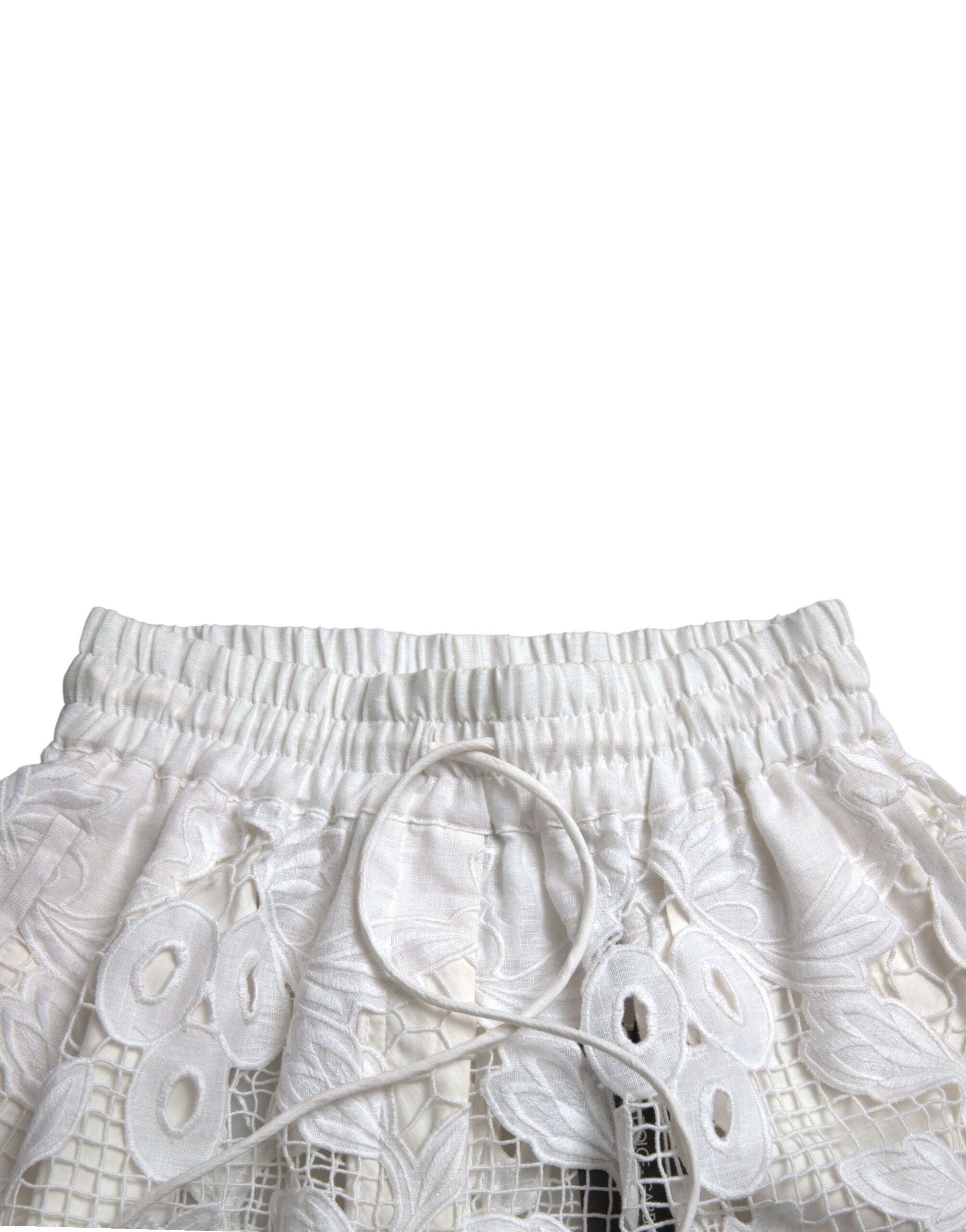 White cotton high waist Bermuda shorts with cutout details, stylishly designed by Dolce & Gabbana.