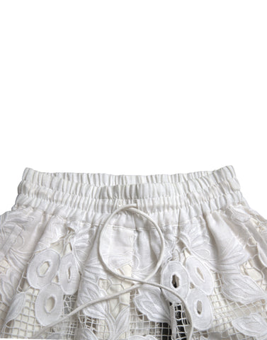 White cotton high waist Bermuda shorts with cutout details, stylishly designed by Dolce & Gabbana.