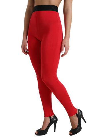 Red nylon Dolce & Gabbana logo slim leggings pants with a fitted design and iconic branding, suitable for stylish casual wear.