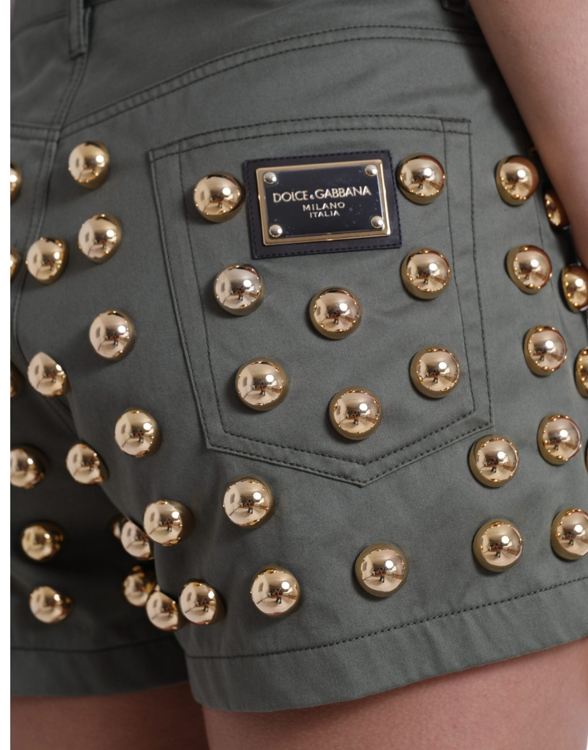 Green cotton high waist hot pants shorts with embellishments by Dolce & Gabbana, featuring decorative details and a fitted style.