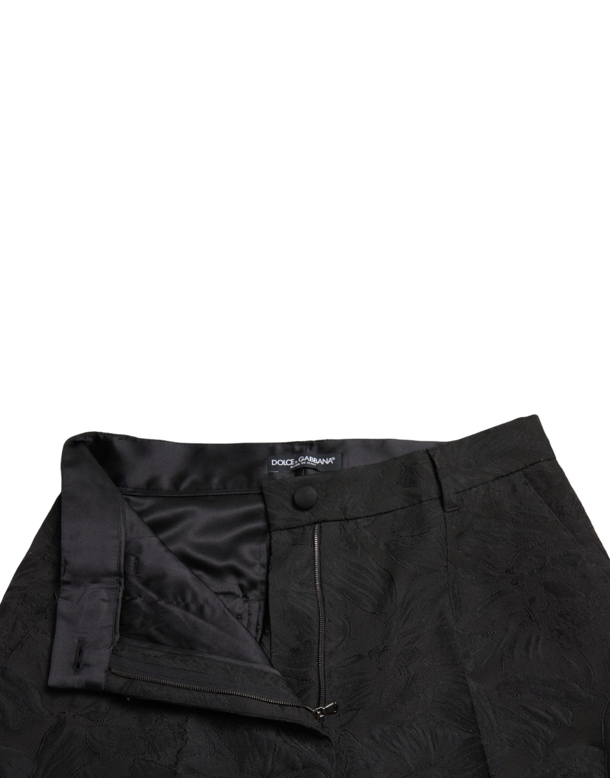 Black polyester high waist tapered pants by Dolce & Gabbana, shown on a model, highlighting the fitted design and sleek silhouette.