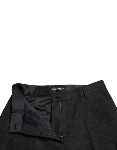 Black polyester high waist tapered pants by Dolce & Gabbana, shown on a model, highlighting the fitted design and sleek silhouette.