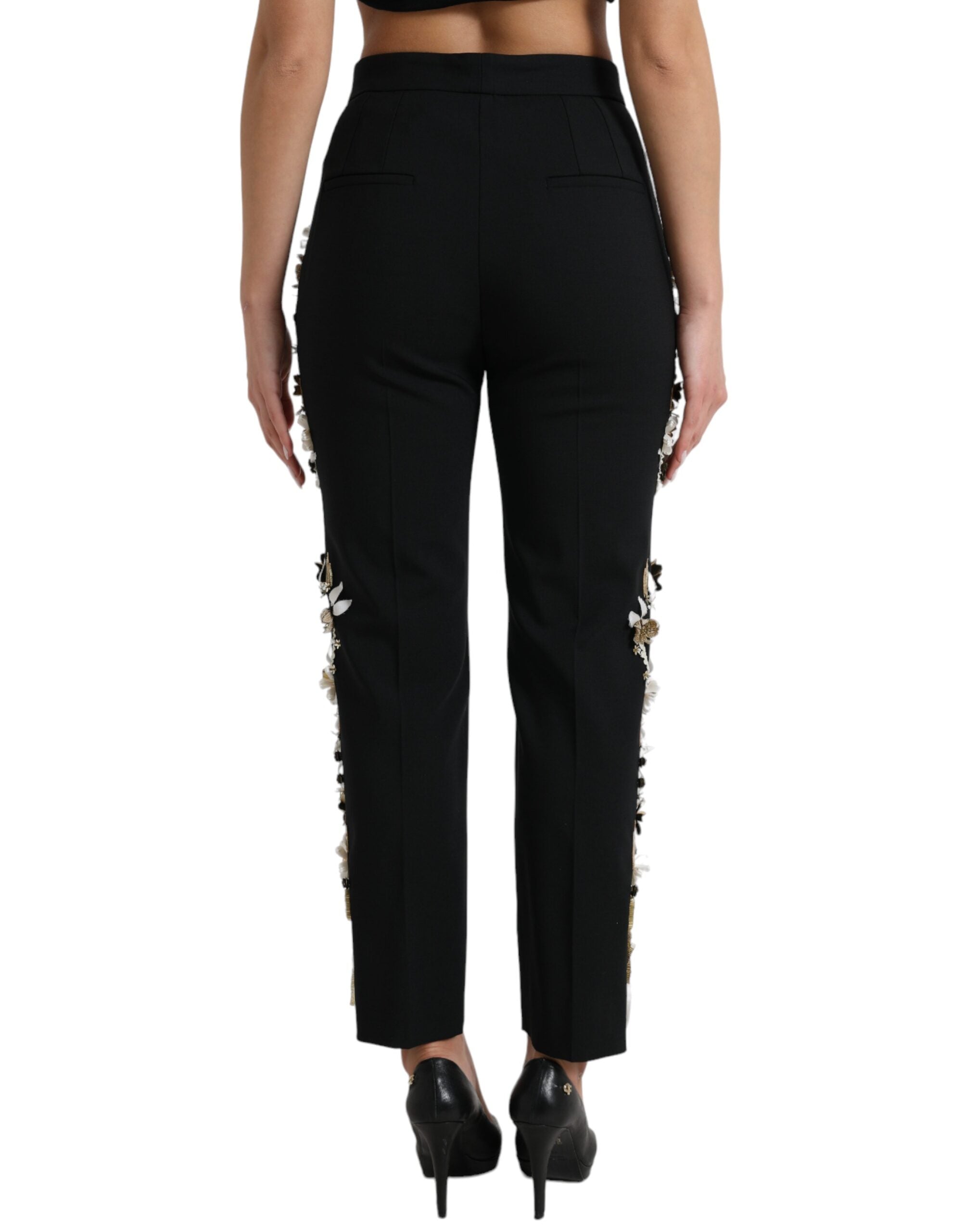 Black floral applique high waist tapered pants by Dolce & Gabbana, showcasing intricate floral details and tailored fit.