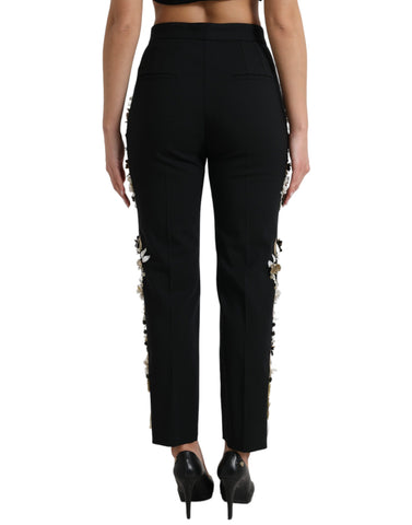 Black floral applique high waist tapered pants by Dolce & Gabbana, showcasing intricate floral details and tailored fit.