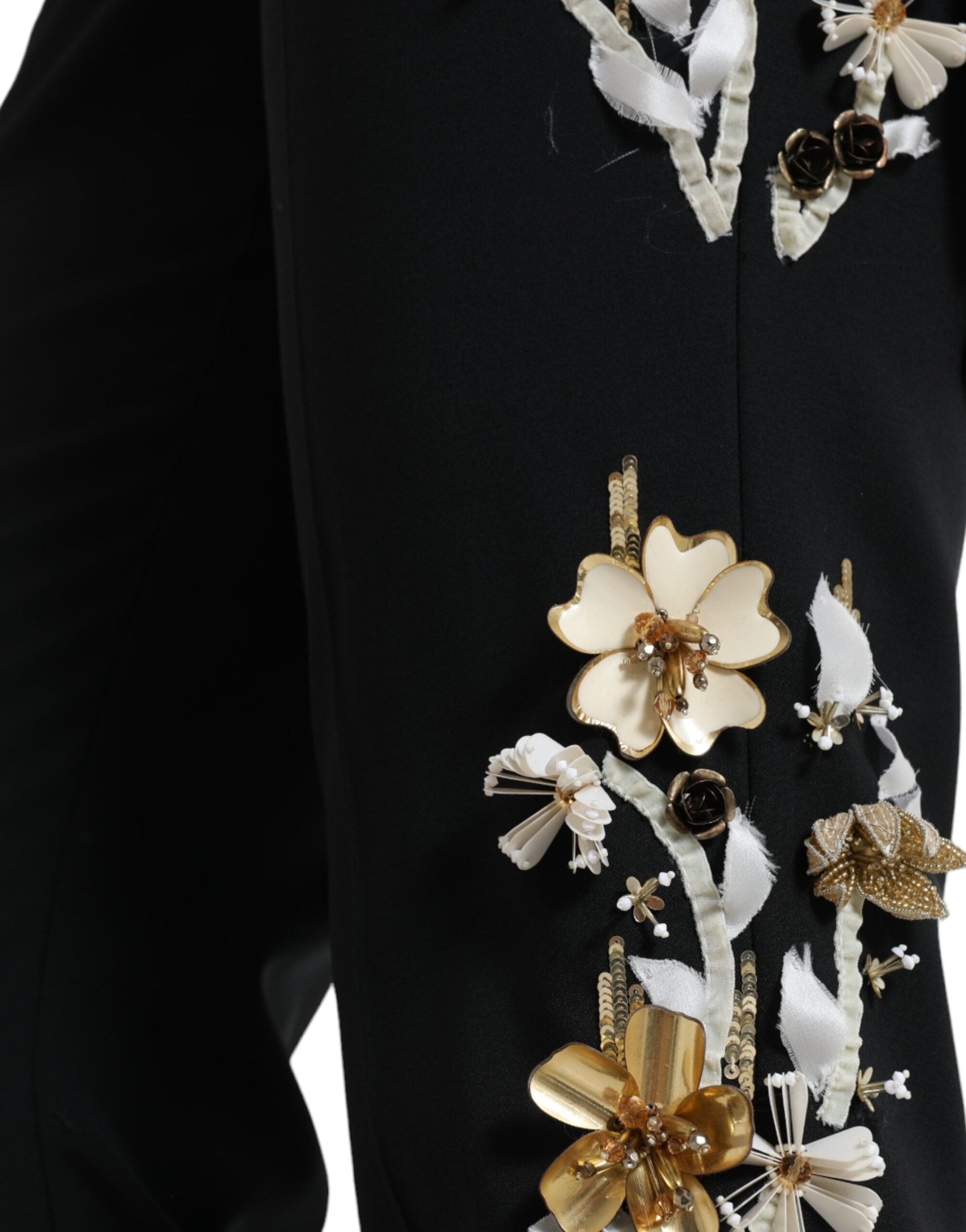 Black floral applique high waist tapered pants by Dolce & Gabbana with elegant floral embroidery and a tailored fit.