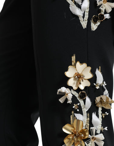 Black floral applique high waist tapered pants by Dolce & Gabbana with elegant floral embroidery and a tailored fit.