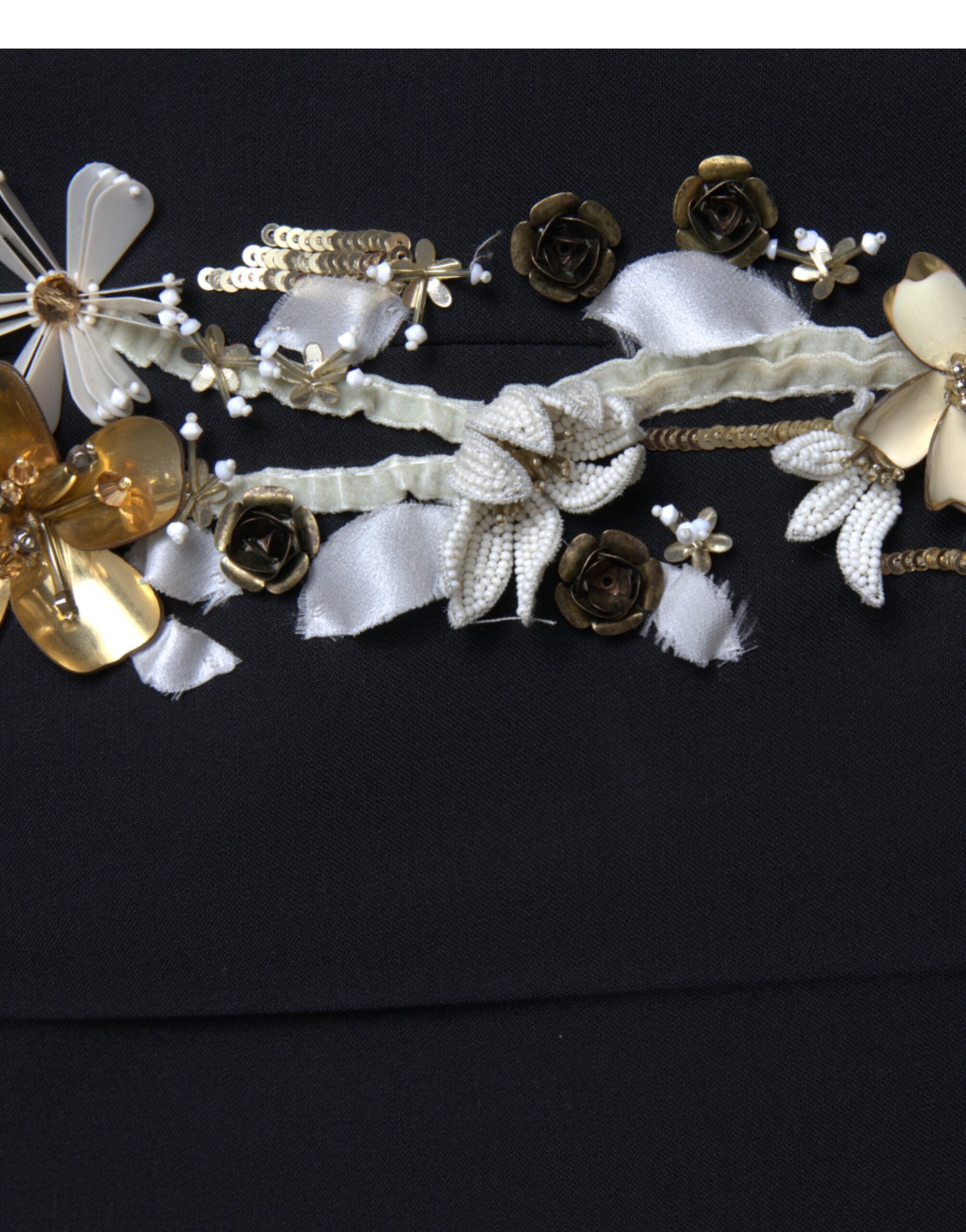 Black floral applique high waist tapered pants by Dolce & Gabbana featuring a fitted waist and elegant floral details.