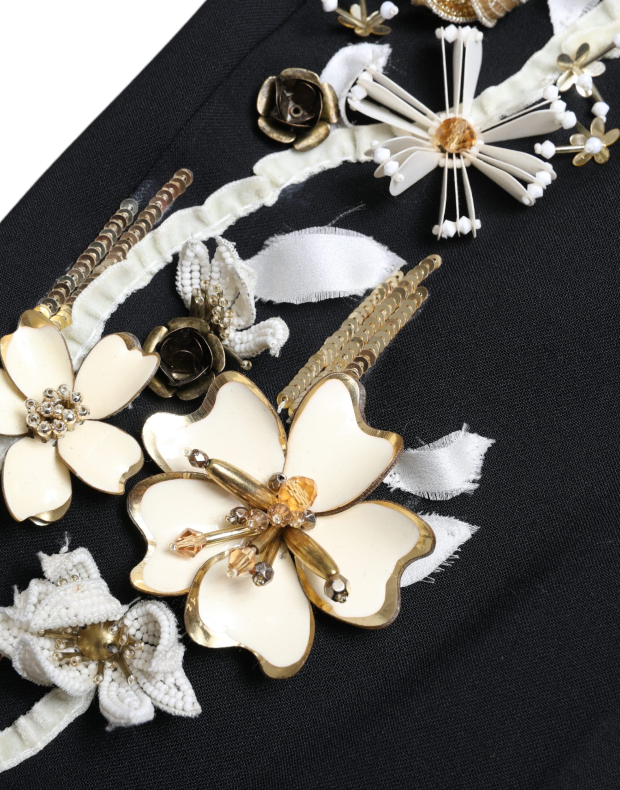 Black floral applique high waist tapered pants by Dolce & Gabbana, featuring intricate floral details and a sleek high-rise fit.