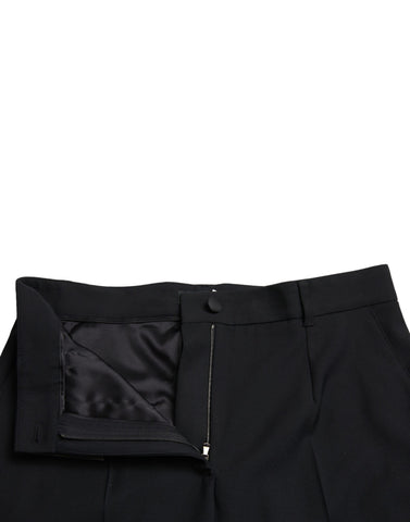 Black wool high waist straight pants by Dolce & Gabbana, displayed on a hanger with a tailored fit and clean design.