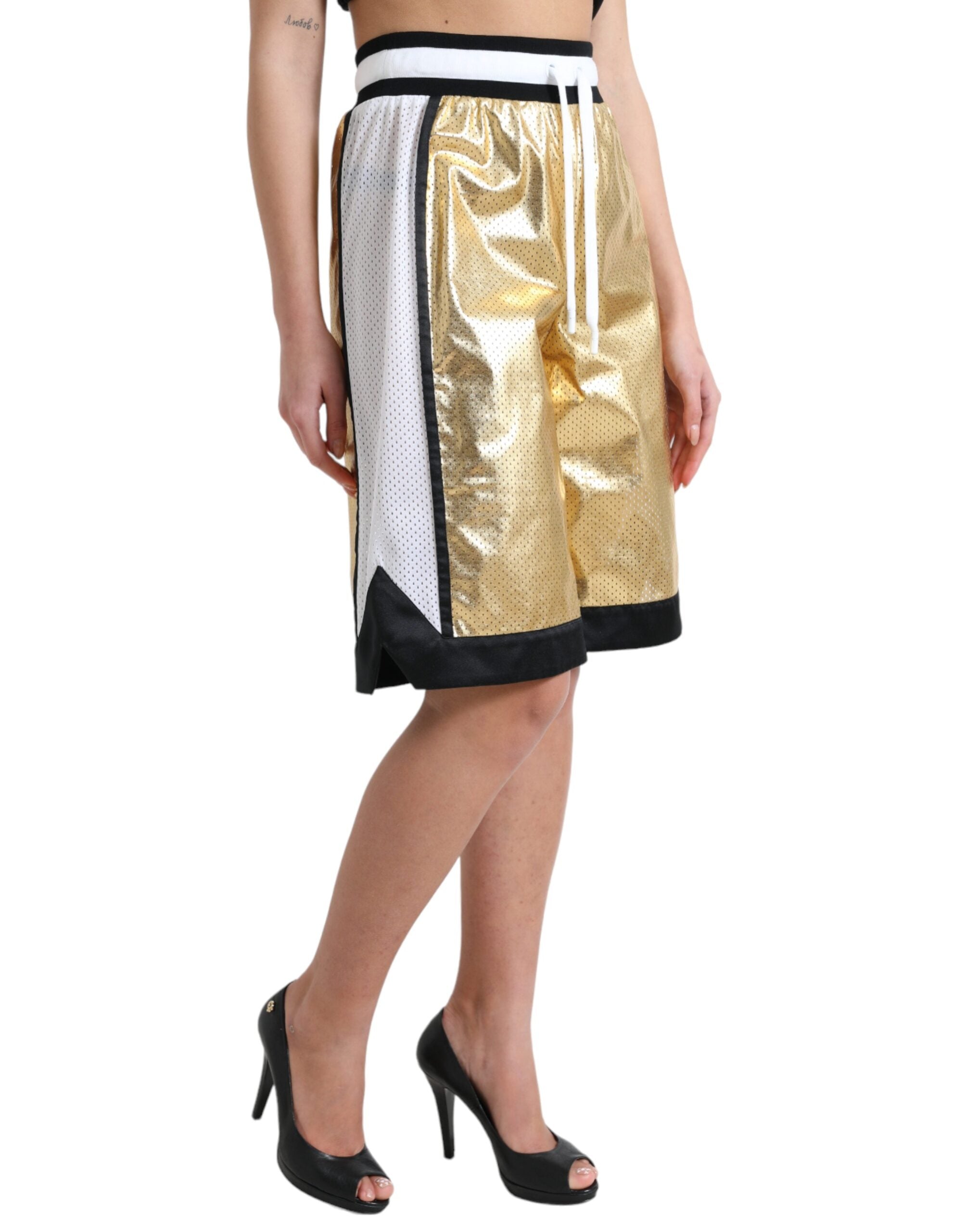 Gold polyester perforated high waist shorts by Dolce & Gabbana, featuring a stylish high-rise fit and breathable perforated design.