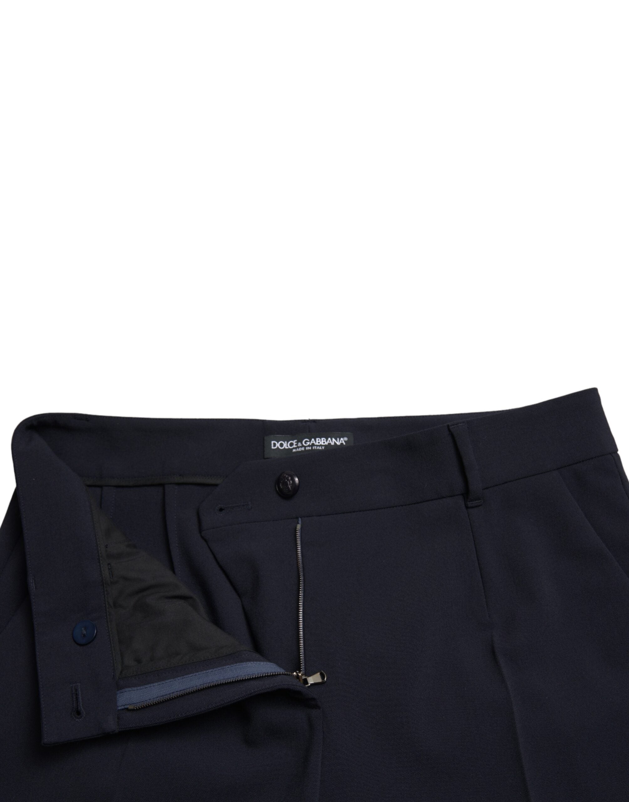 Blue mid waist tapered cropped pants by Dolce & Gabbana, showing the fitted waistband and stylish tapered leg design.