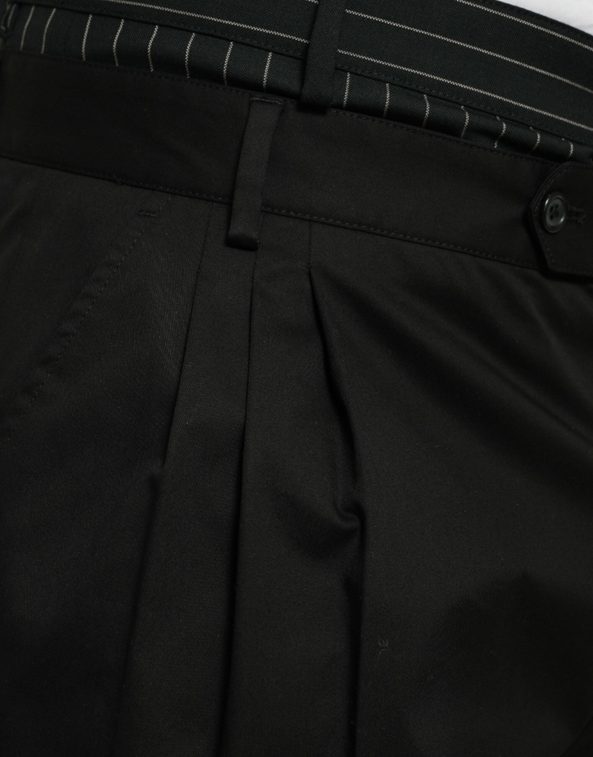 Black cotton stretch cargo Bermuda shorts by Dolce & Gabbana, showing a close-up of the fabric and pocket details.