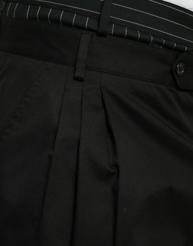 Black cotton stretch cargo Bermuda shorts by Dolce & Gabbana, showing a close-up of the fabric and pocket details.