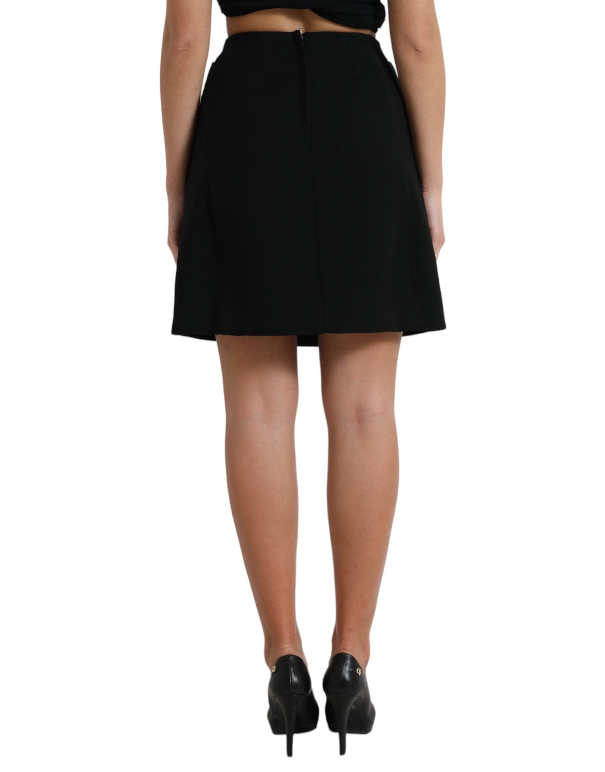 Black wool high waist A-line mini skirt with button details from Dolce & Gabbana, showcasing its stylish fit and texture.