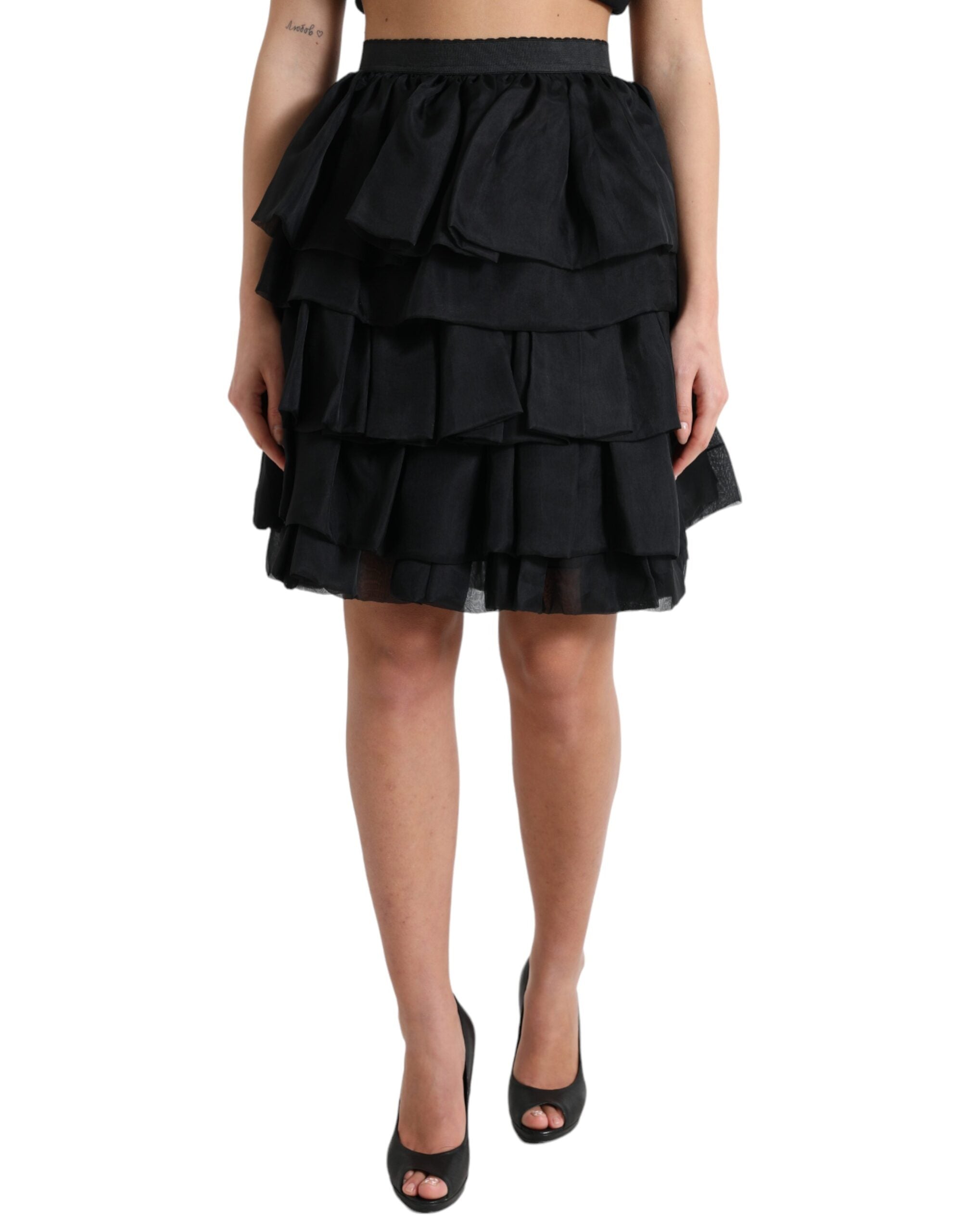 Black tiered A-line high-waist silk mini skirt by Dolce & Gabbana, featuring a stylish, flowing design and elegant high-rise silhouette.