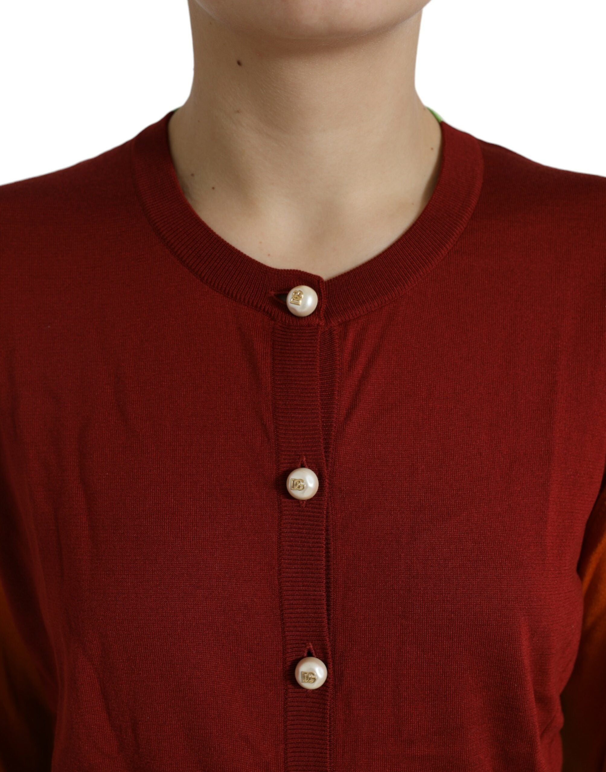 Dolce & Gabbana multicolor color block silk crewneck cardigan sweater displayed on a hanger.