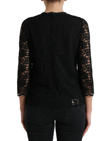 Black Dolce & Gabbana floral lace nylon blouse with long sleeves and elegant design, displayed on a plain background.