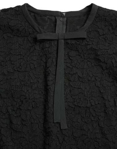 Black Dolce & Gabbana floral lace nylon blouse with long sleeves and intricate lace detailing.