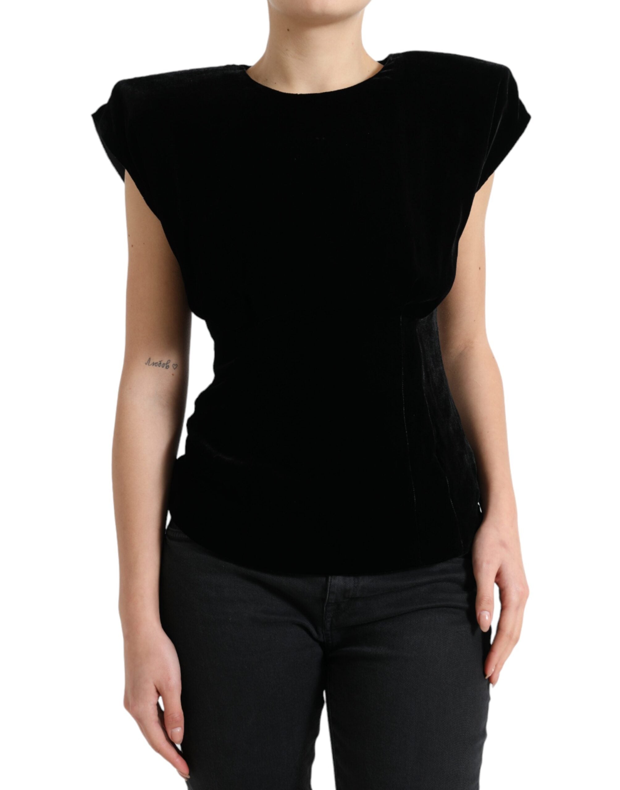 Black velvet fitted blouse with padded shoulders from Dolce & Gabbana, shown on a hanger with a smooth background.