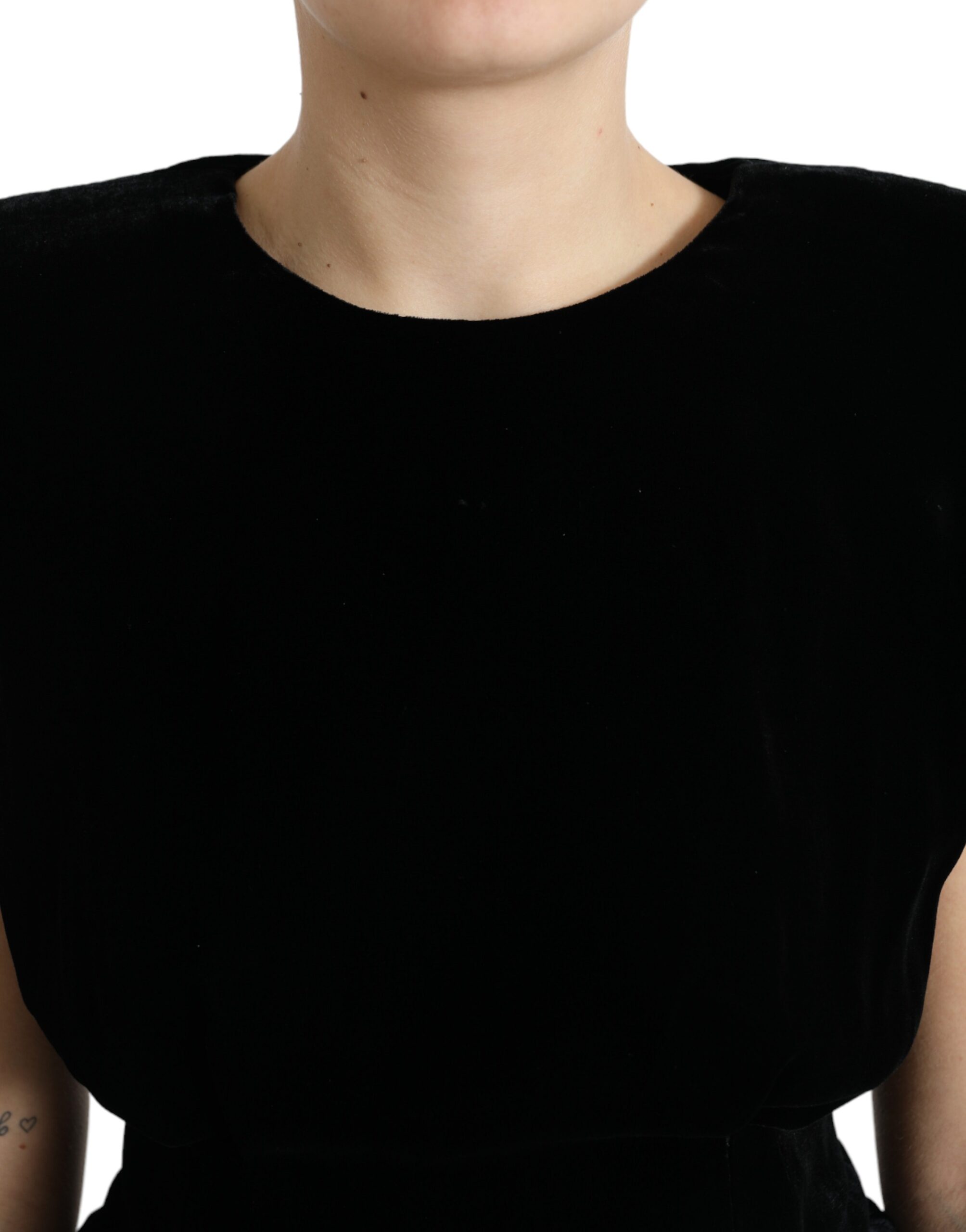 Black velvet fitted blouse with padded shoulders by Dolce & Gabbana, featuring a sleek, elegant design and a high neckline.