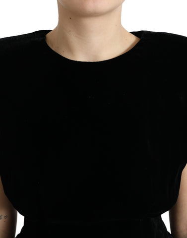 Black velvet fitted blouse with padded shoulders by Dolce & Gabbana, featuring a sleek, elegant design and a high neckline.