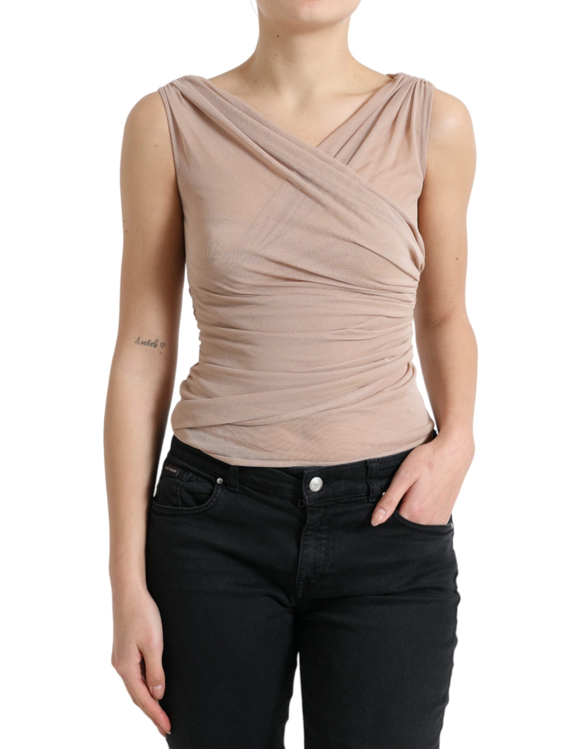 Beige viscose V-neck sleeveless tank top by Dolce & Gabbana displayed on a hanger.