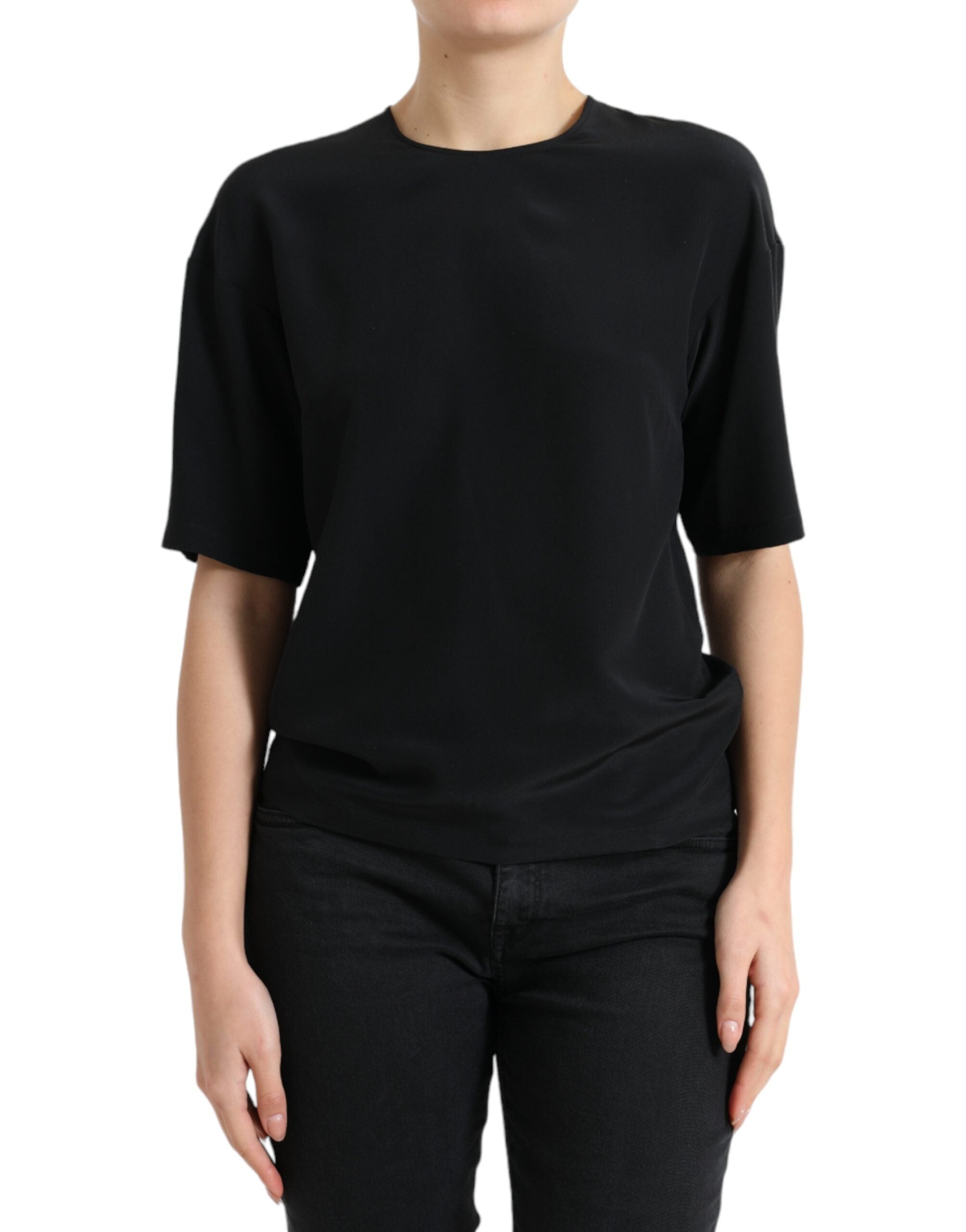 Black silk round neck short sleeve blouse top by Dolce & Gabbana, shown on a hanger with smooth fabric and classic design.