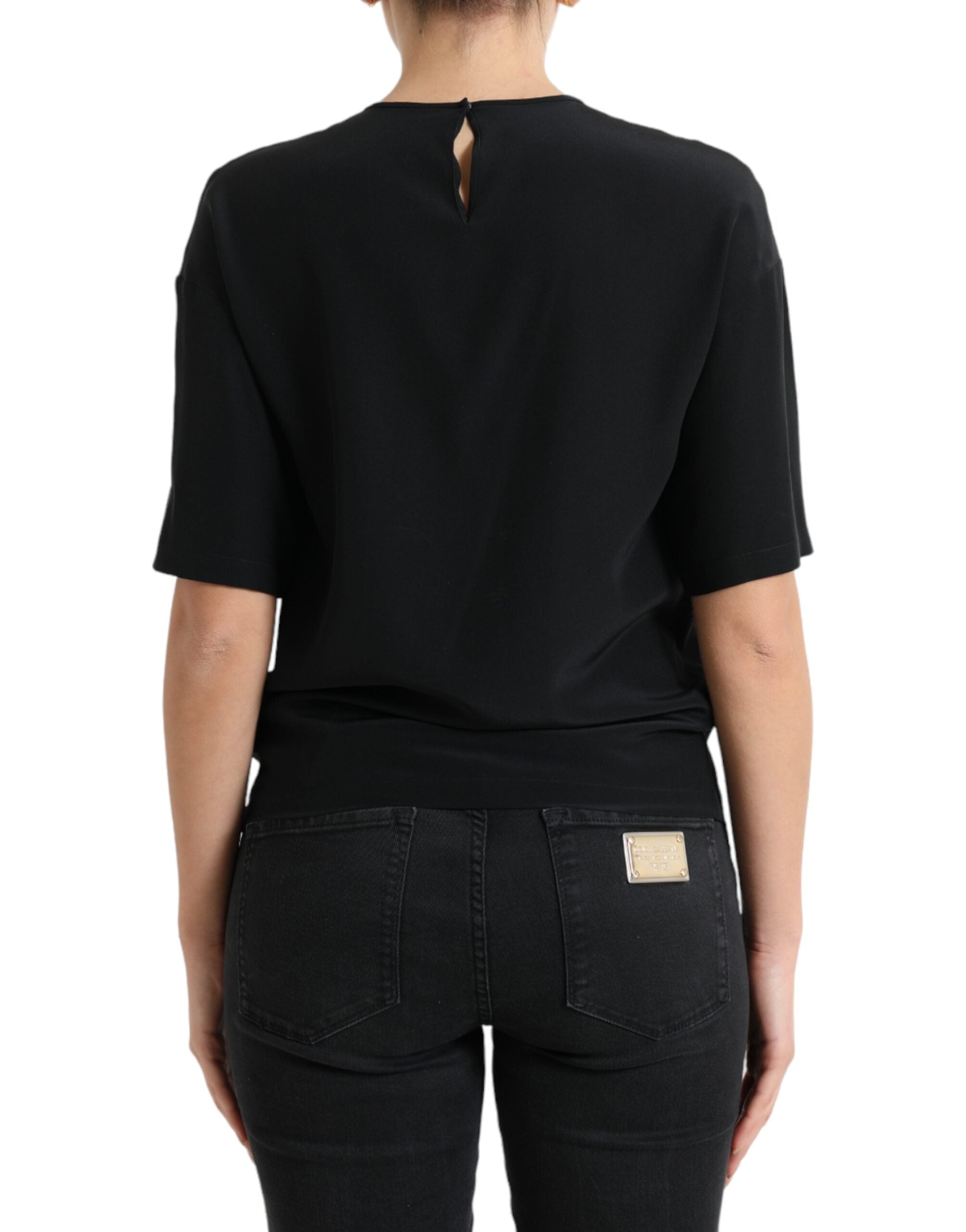 Black silk round neck short sleeve blouse top by Dolce & Gabbana, featuring a smooth fabric and classic fit.