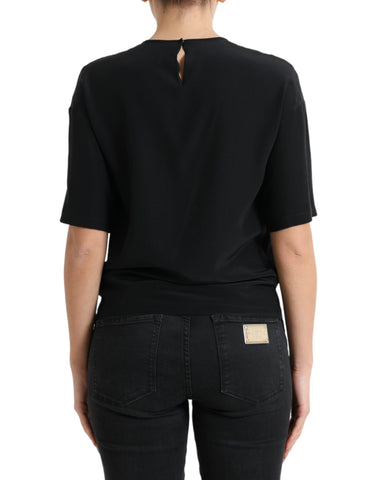 Black silk round neck short sleeve blouse top by Dolce & Gabbana, featuring a smooth fabric and classic fit.