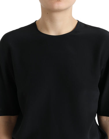 Black silk round neck short sleeve blouse top by Dolce & Gabbana, shown with a smooth, fitted fabric and classic silhouette.