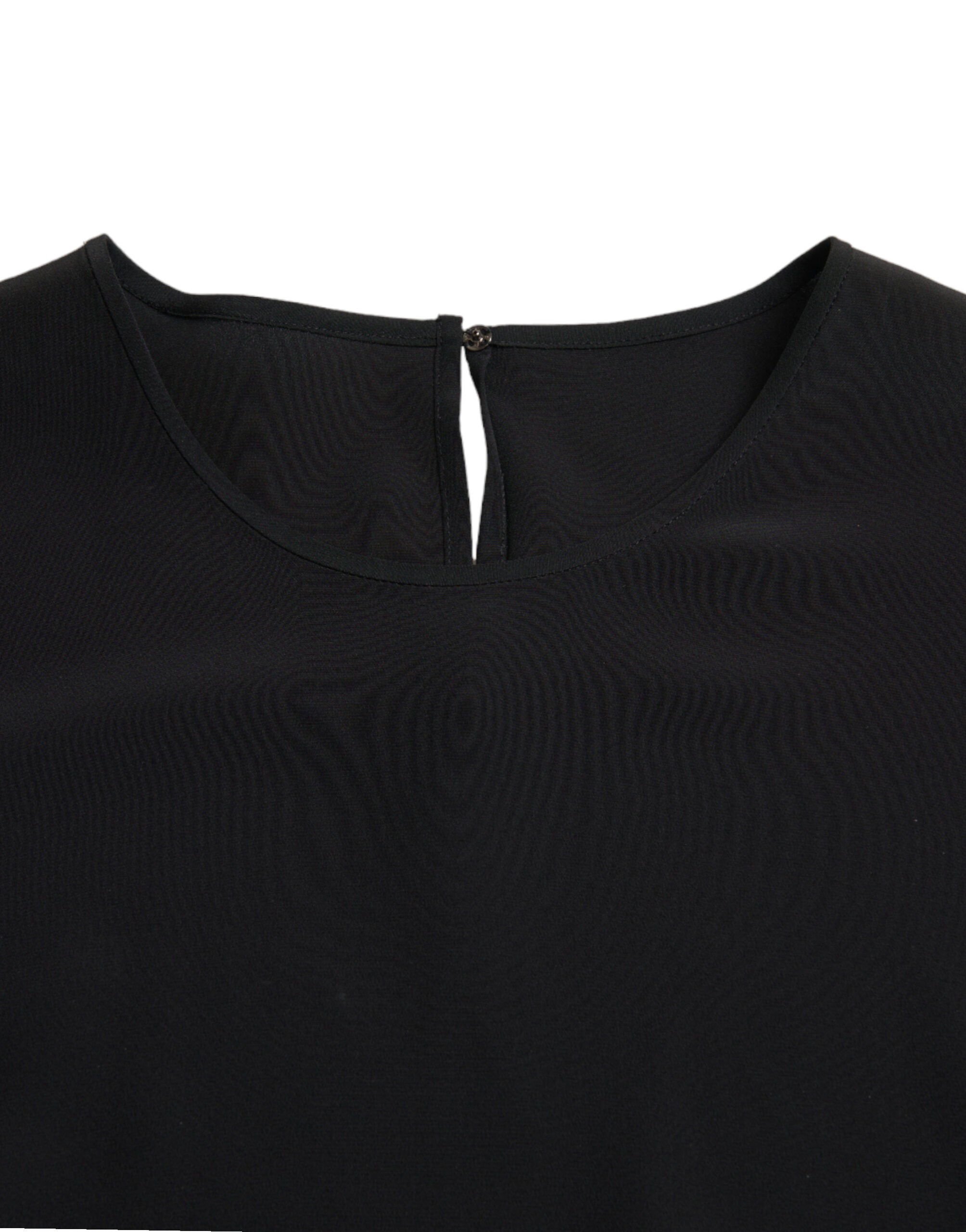 Black silk round neck short sleeve blouse top by Dolce & Gabbana, shown on a hanger with smooth fabric and classic design.
