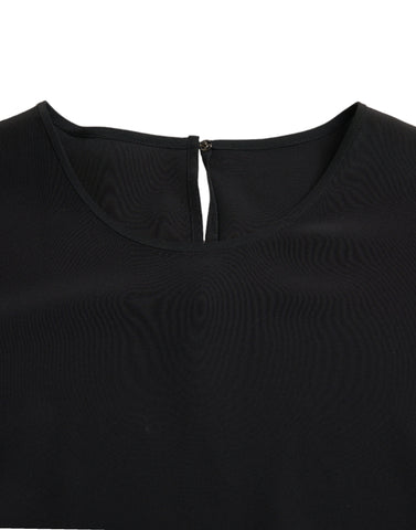 Black silk round neck short sleeve blouse top by Dolce & Gabbana, shown on a hanger with smooth fabric and classic design.