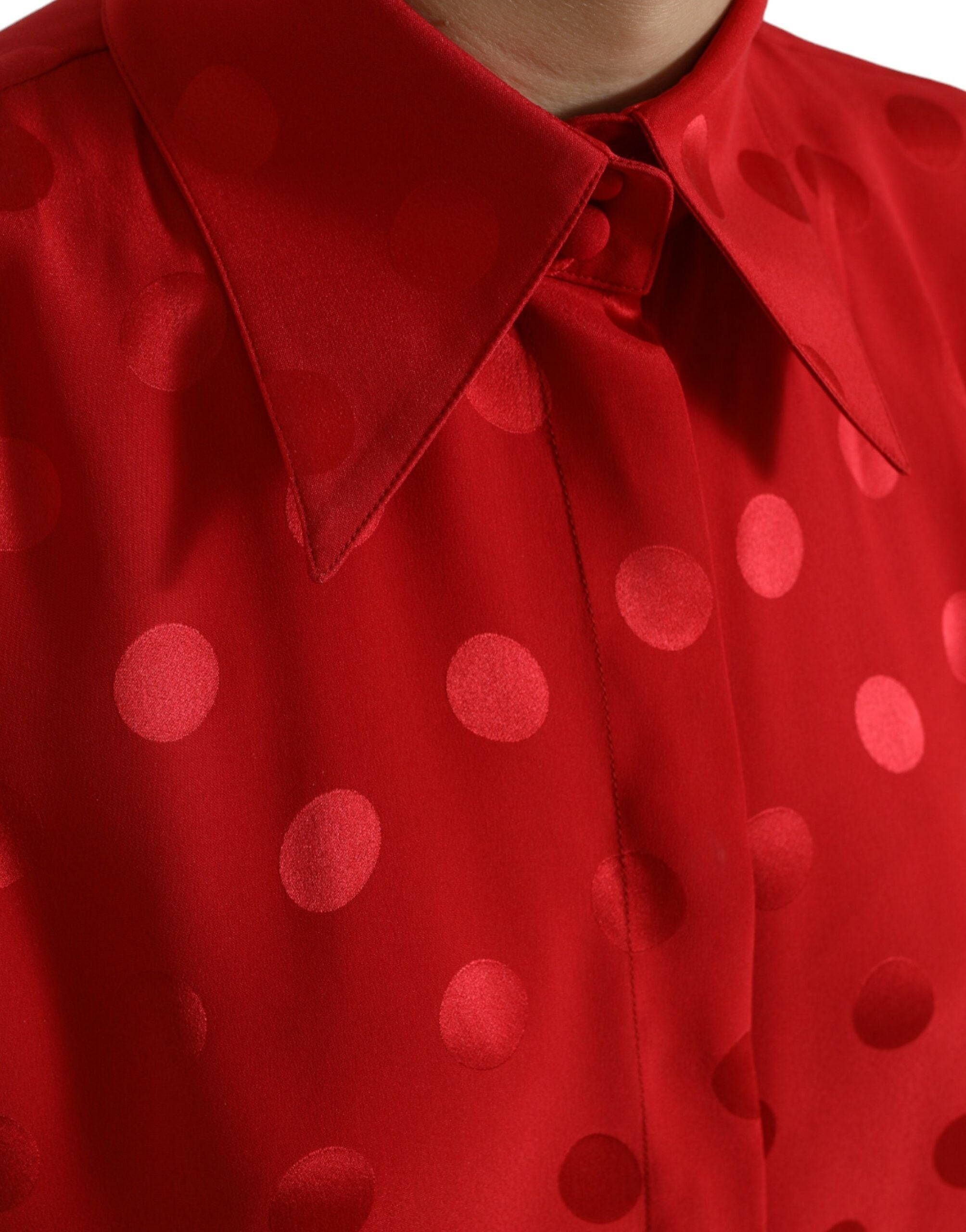 Red polka dot sleeveless collared blouse top by Dolce & Gabbana, featuring a stylish design with a classic collar and vibrant pattern.